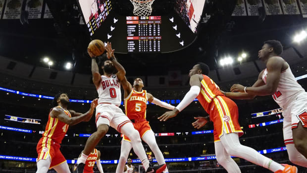 Atlanta Hawks guard Dejounte Murray (5) defends Chicago Bulls guard Coby White (0) during the second half at United Center.